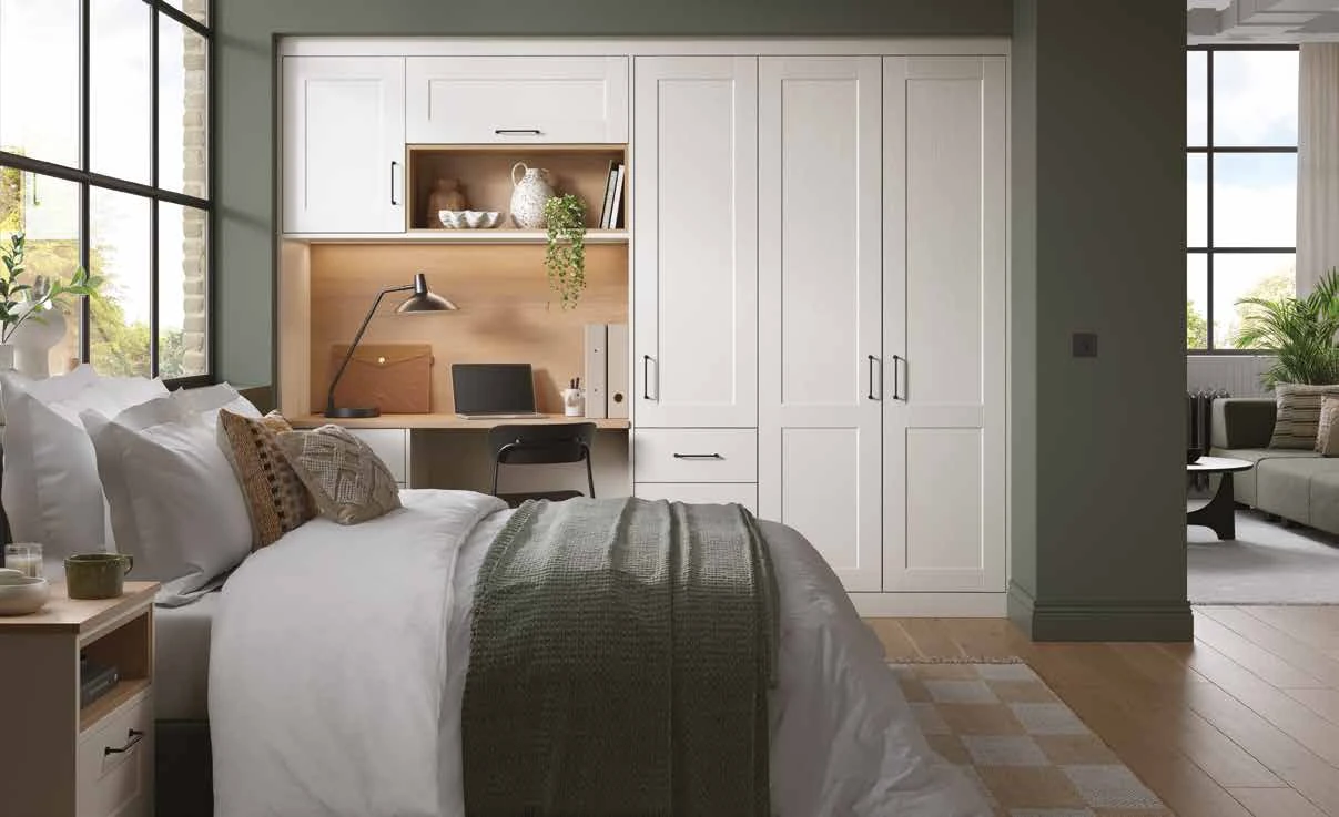 Fitted bedroom with shaker wardrobes, window seat and integrated storage