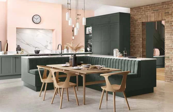 Classic painted shaker kitchen with dining banquette and fitted cabinetry