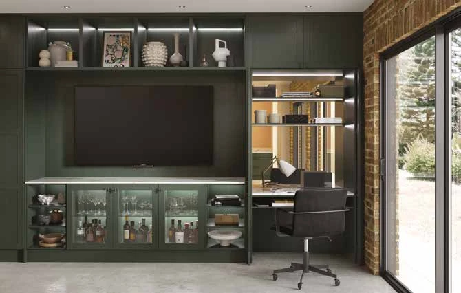 Fitted dark-green home office and display cabinetry