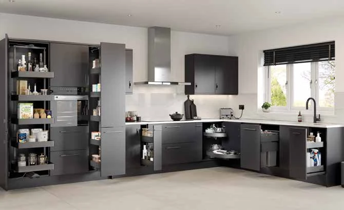 Kitchen cabinetry opened to show pull-out larder and internal storage systems
