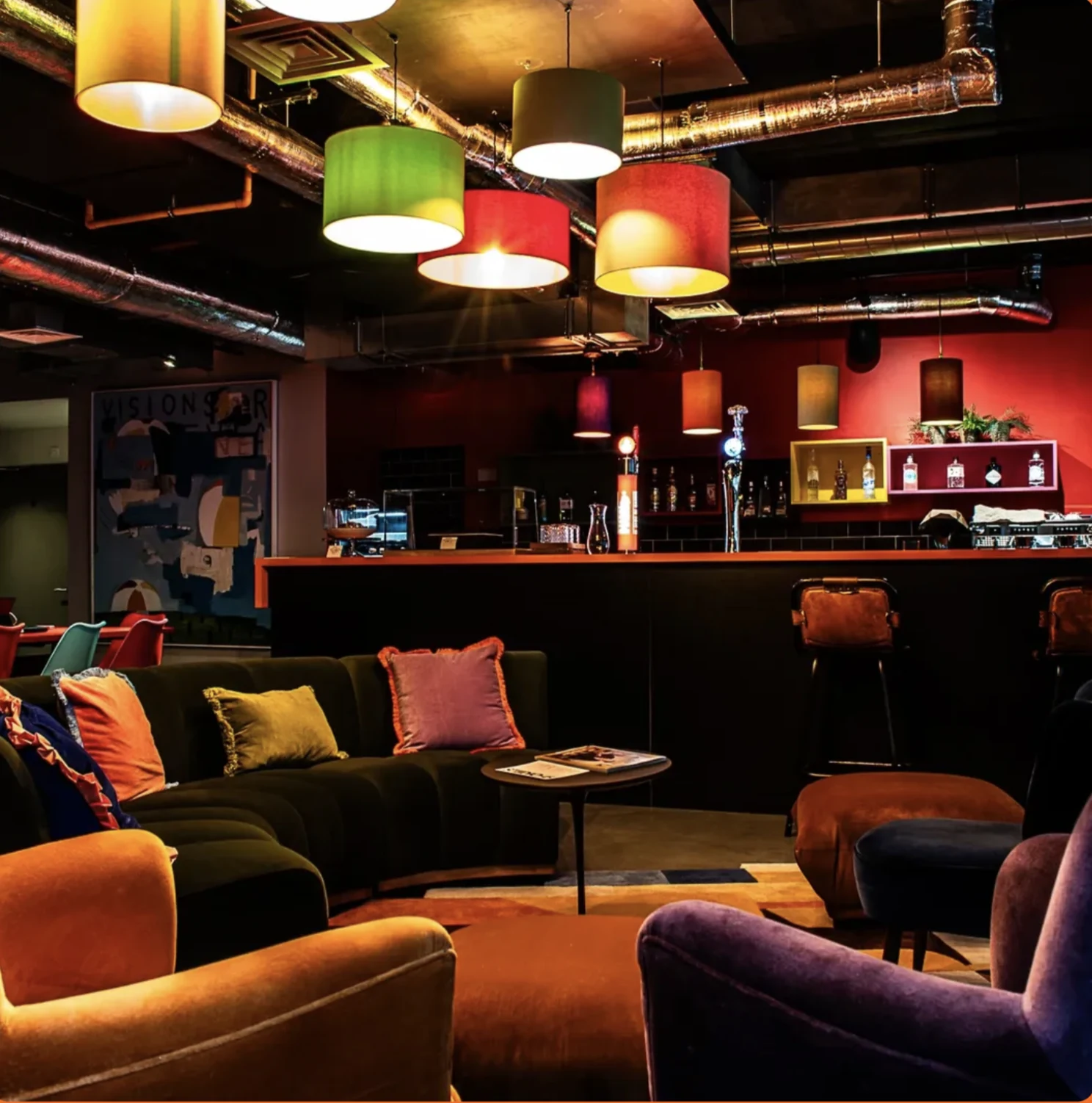 Studio 45 lounge and bar with colourful pendant lighting and upholstered seating